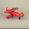 Avion biplan rouge mécanique