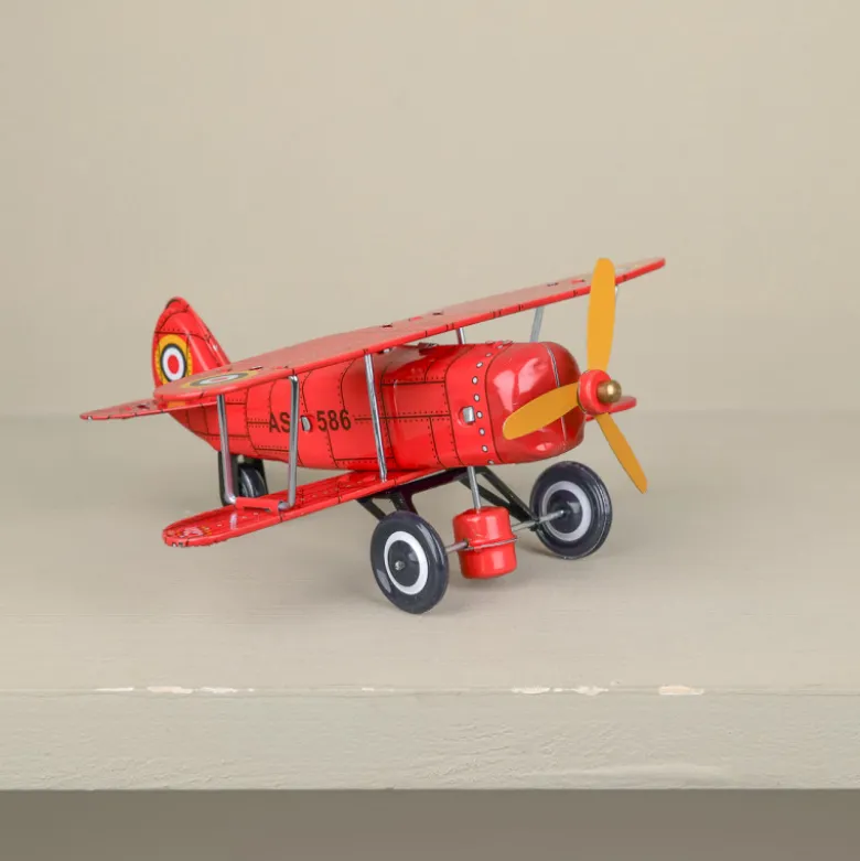 Avion biplan rouge mécanique