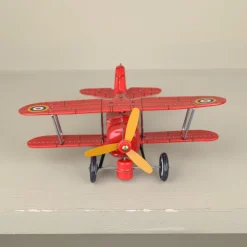 Avion biplan rouge mécanique